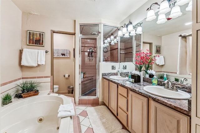 full bathroom with tile patterned floors, vanity, independent shower and bath, and toilet