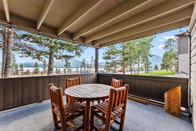 sunroom / solarium with a mountain view