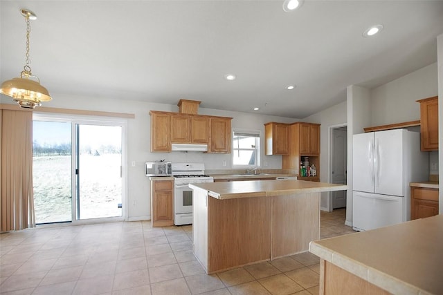 kitchen featuring under cabinet range hood, a kitchen island, white appliances, light countertops, and vaulted ceiling