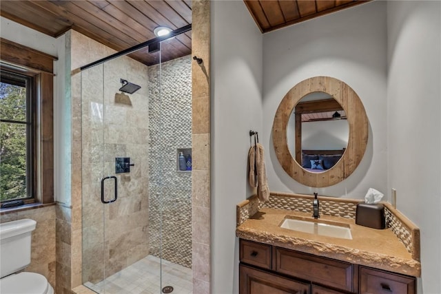 bathroom featuring an enclosed shower, vanity, wooden ceiling, and toilet