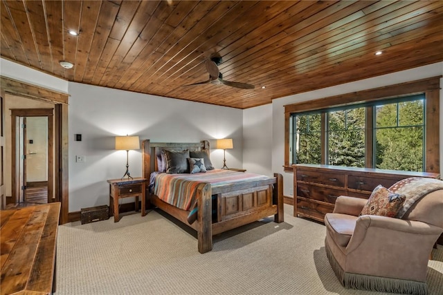 carpeted bedroom with wooden ceiling and ceiling fan