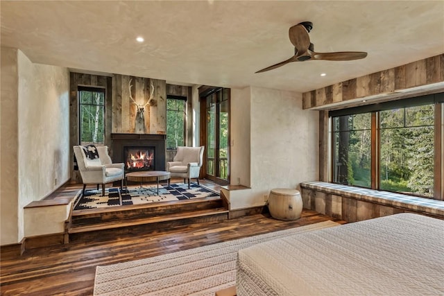 sitting room with hardwood / wood-style flooring and ceiling fan