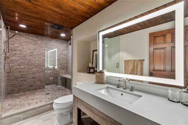 bathroom with a shower with door, vanity, wooden ceiling, and toilet