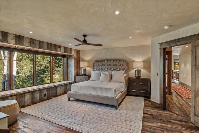 bedroom featuring dark wood-type flooring and ceiling fan