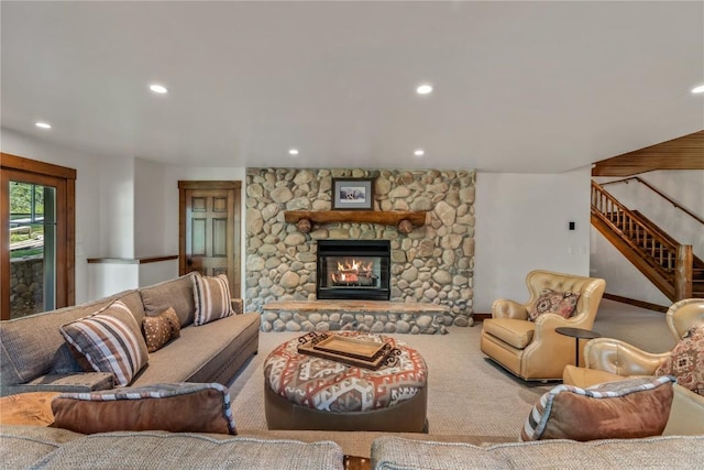 living room with carpet floors and a fireplace