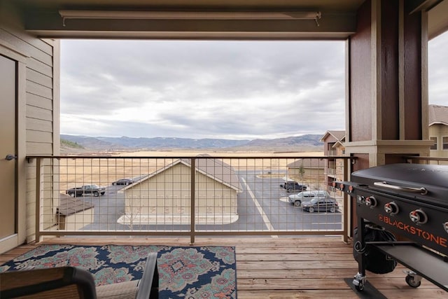 exterior space featuring a mountain view and grilling area