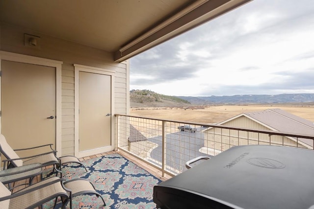 balcony featuring a mountain view