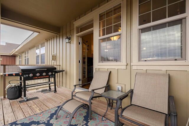 wooden deck with grilling area