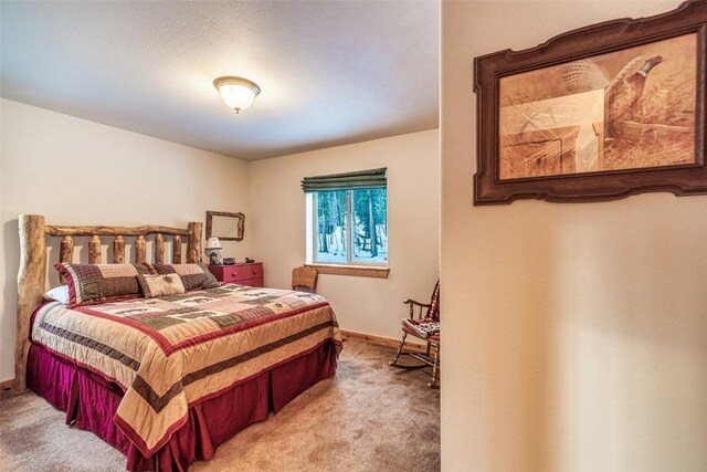 bedroom featuring carpet