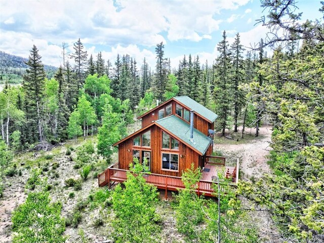 rear view of property with a deck