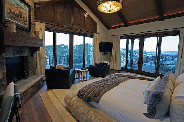 bedroom featuring wooden ceiling, french doors, a fireplace, beam ceiling, and wood-type flooring