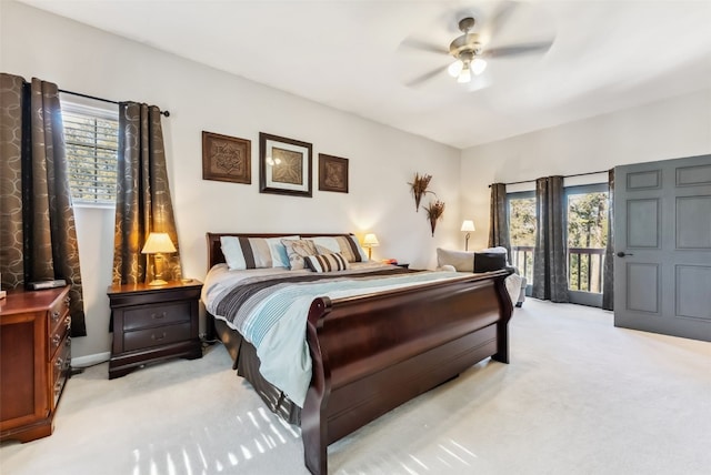 bedroom featuring light carpet, ceiling fan, and access to exterior