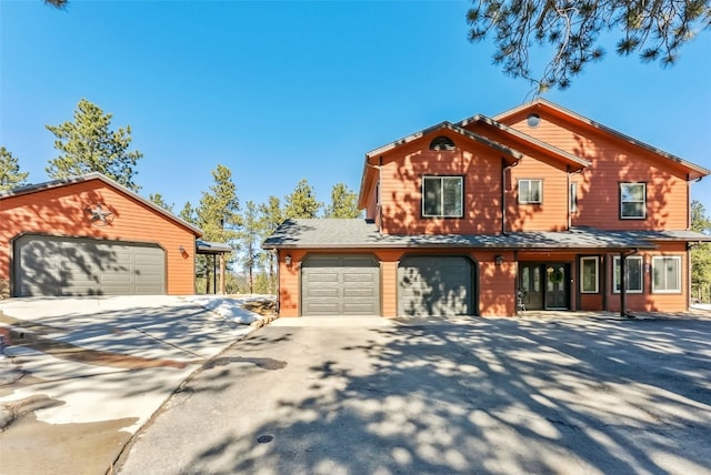 view of front of property with a garage and driveway