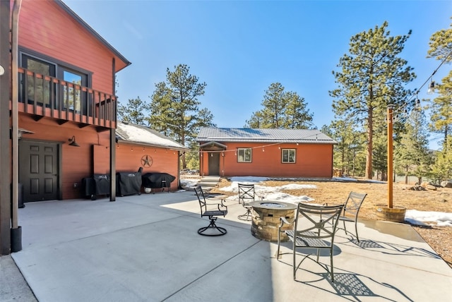 view of patio featuring a fire pit and grilling area