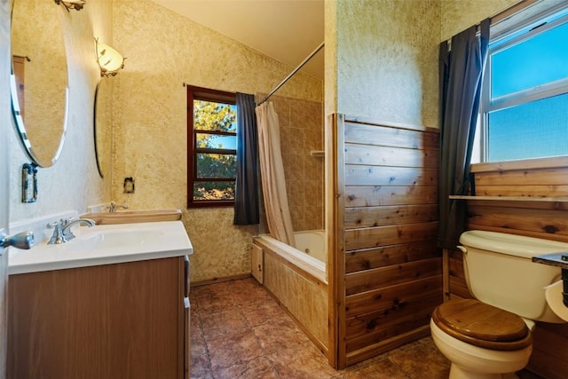 full bathroom with vanity, shower / bathtub combination with curtain, and toilet