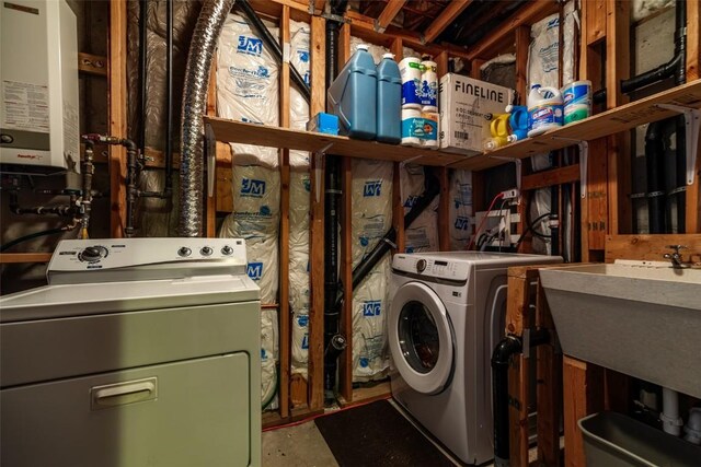 washroom with separate washer and dryer and water heater