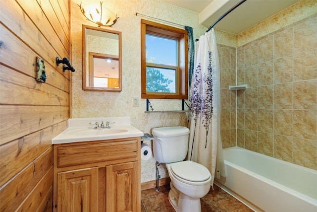 full bathroom with tile patterned flooring, vanity, shower / bath combo, and toilet