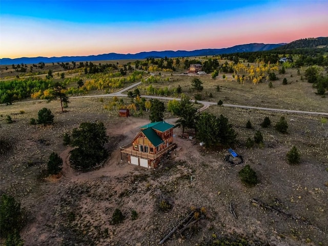 aerial view at dusk with a mountain view