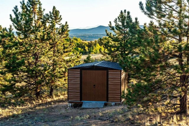 view of outbuilding featuring a mountain view