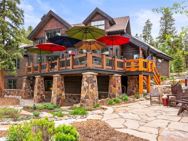 exterior space featuring a patio and a wooden deck