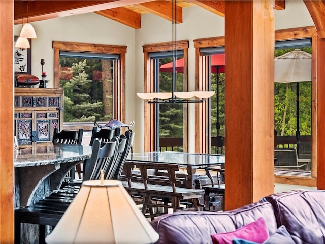 interior space featuring lofted ceiling with beams