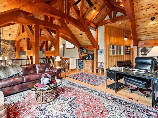 living room featuring wooden ceiling, beverage cooler, beamed ceiling, high vaulted ceiling, and wood-type flooring