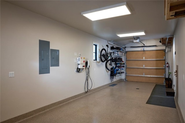 garage with electric panel and a garage door opener