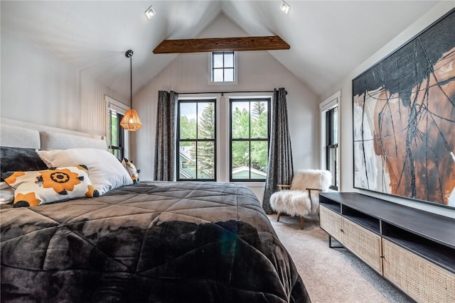 carpeted bedroom featuring lofted ceiling with beams