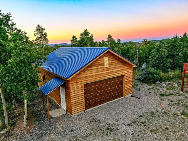 view of front facade with a garage and an outdoor structure