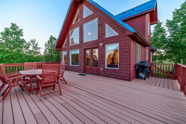 wooden deck featuring area for grilling