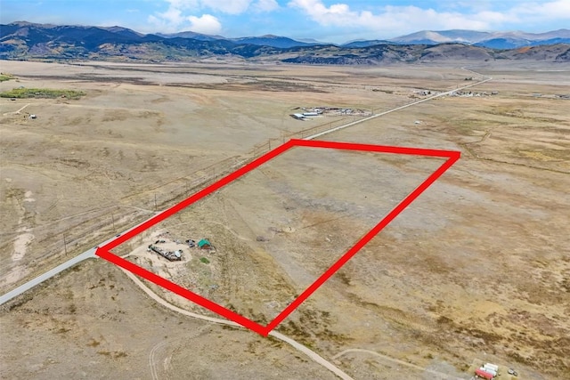 birds eye view of property with a mountain view