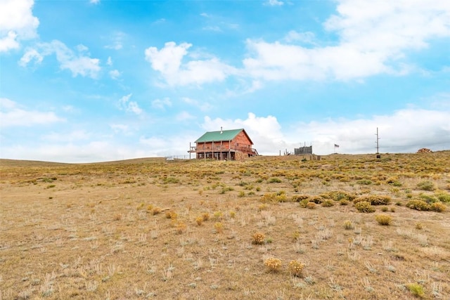 view of yard with a rural view