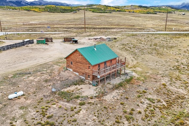 birds eye view of property with a mountain view and a rural view