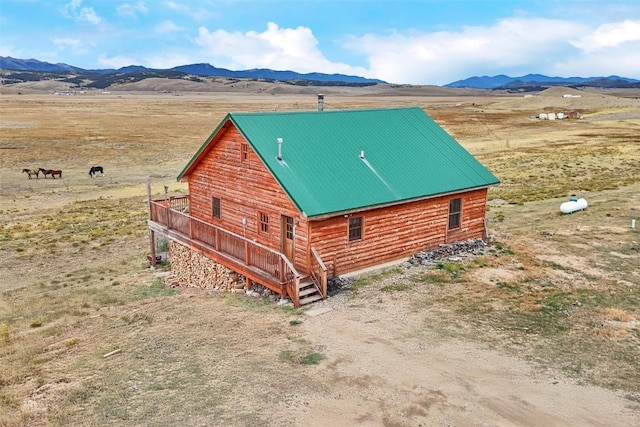 drone / aerial view featuring a mountain view and a rural view