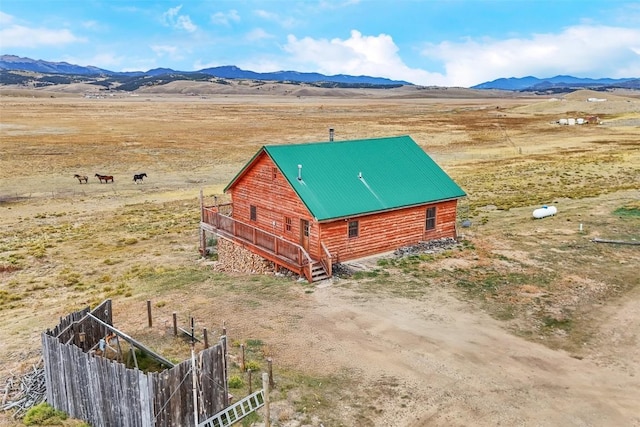 birds eye view of property featuring a mountain view and a rural view