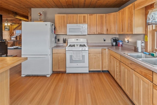 kitchen featuring ceiling fan, sink, light hardwood / wood-style floors, white appliances, and light brown cabinetry