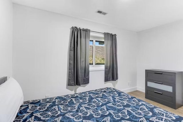 bedroom featuring hardwood / wood-style floors