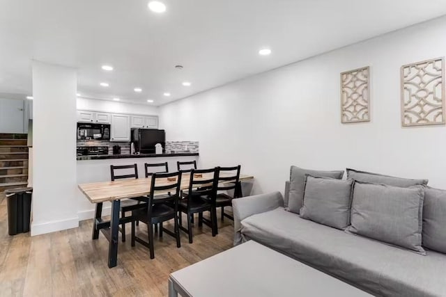 dining room with light wood-type flooring