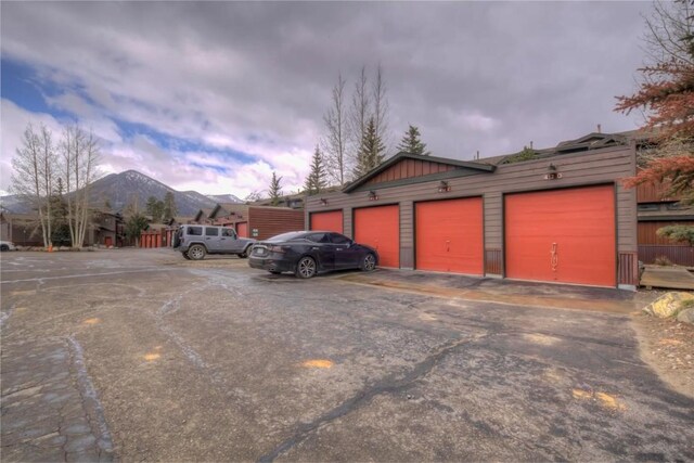 garage at dusk with a mountain view