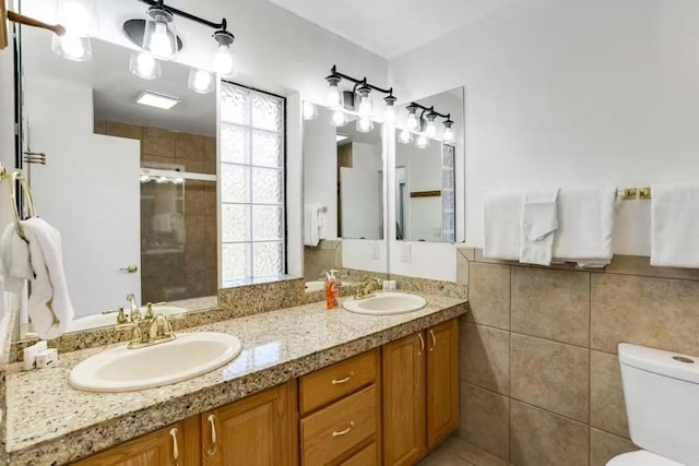 bathroom with vanity, an enclosed shower, and toilet