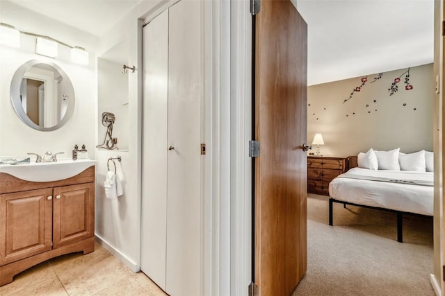 bathroom with tile patterned floors and vanity