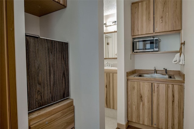 bathroom with vanity and a textured ceiling