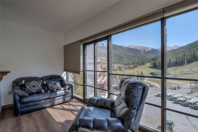 sunroom / solarium with a mountain view