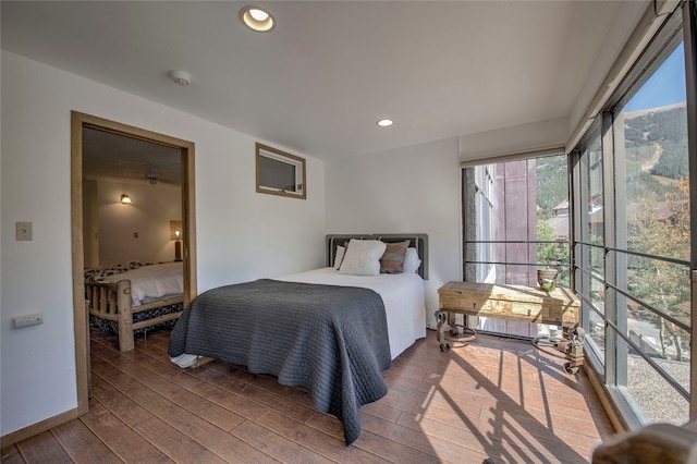 bedroom with wood-type flooring