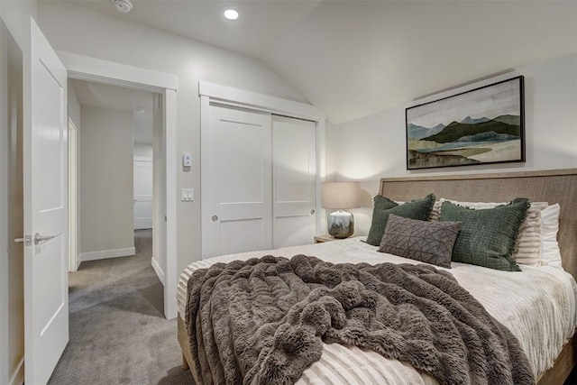 bedroom featuring baseboards, carpet floors, lofted ceiling, recessed lighting, and a closet