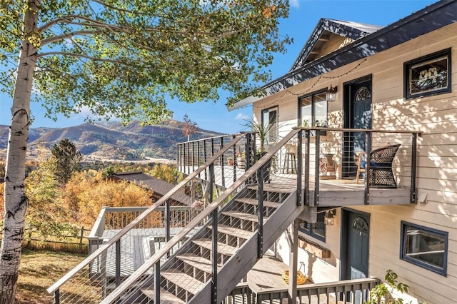 exterior space with stairs and a mountain view