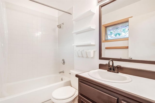 bathroom with vanity, shower / tub combo, and toilet