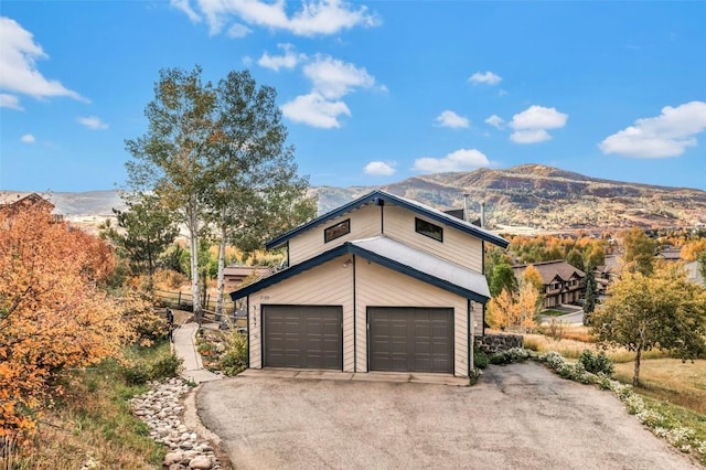 exterior space featuring a mountain view and a garage