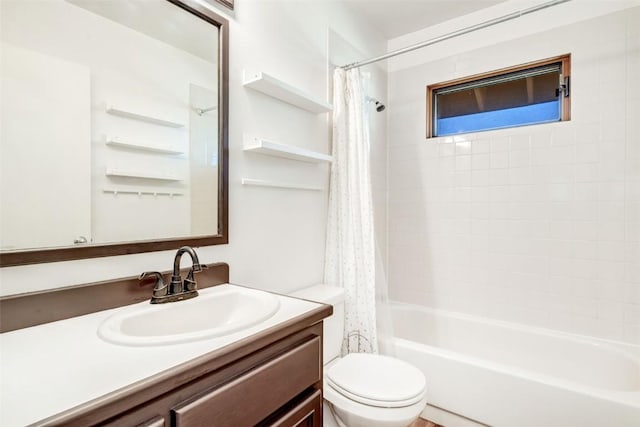 bathroom featuring toilet, shower / bath combo, and vanity