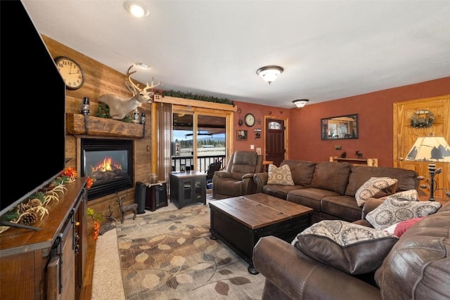 living room with a stone fireplace